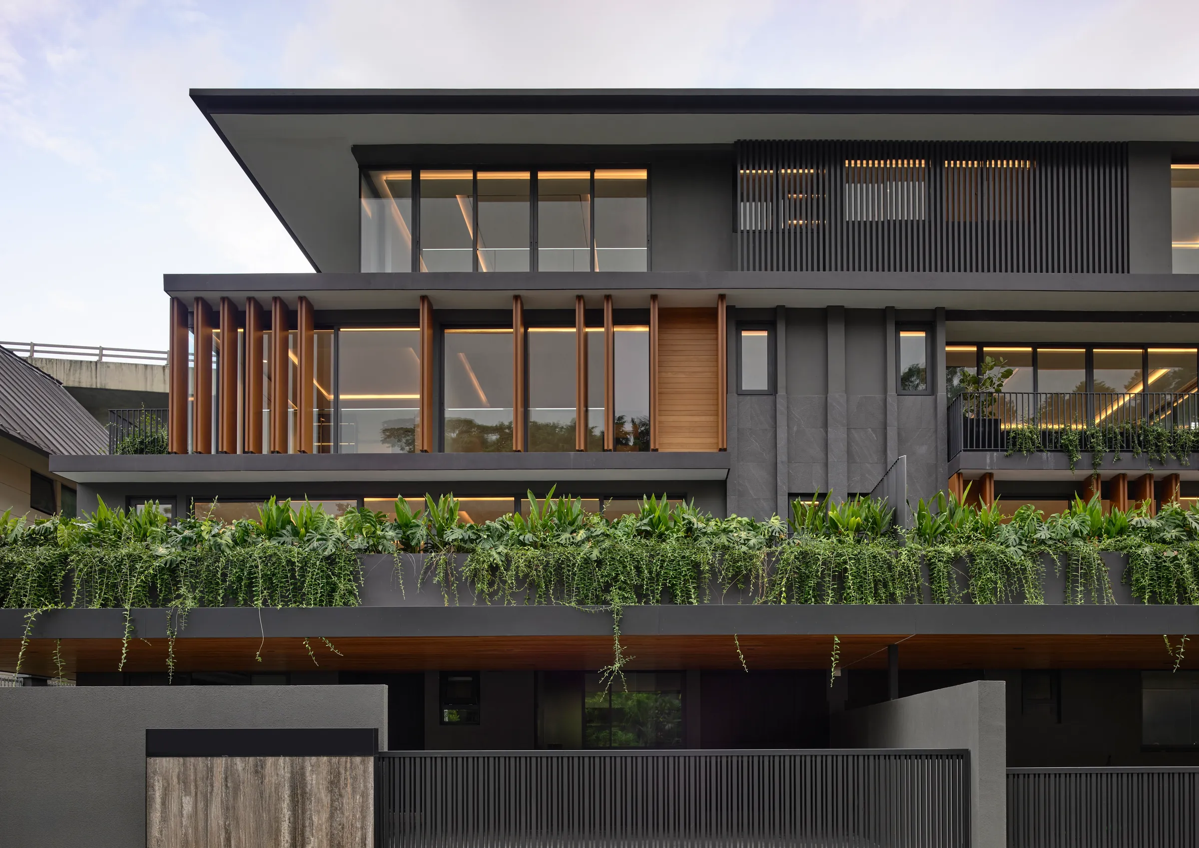 39 Westlake Avenue from the street, its planted terraces stepping back above the gate.