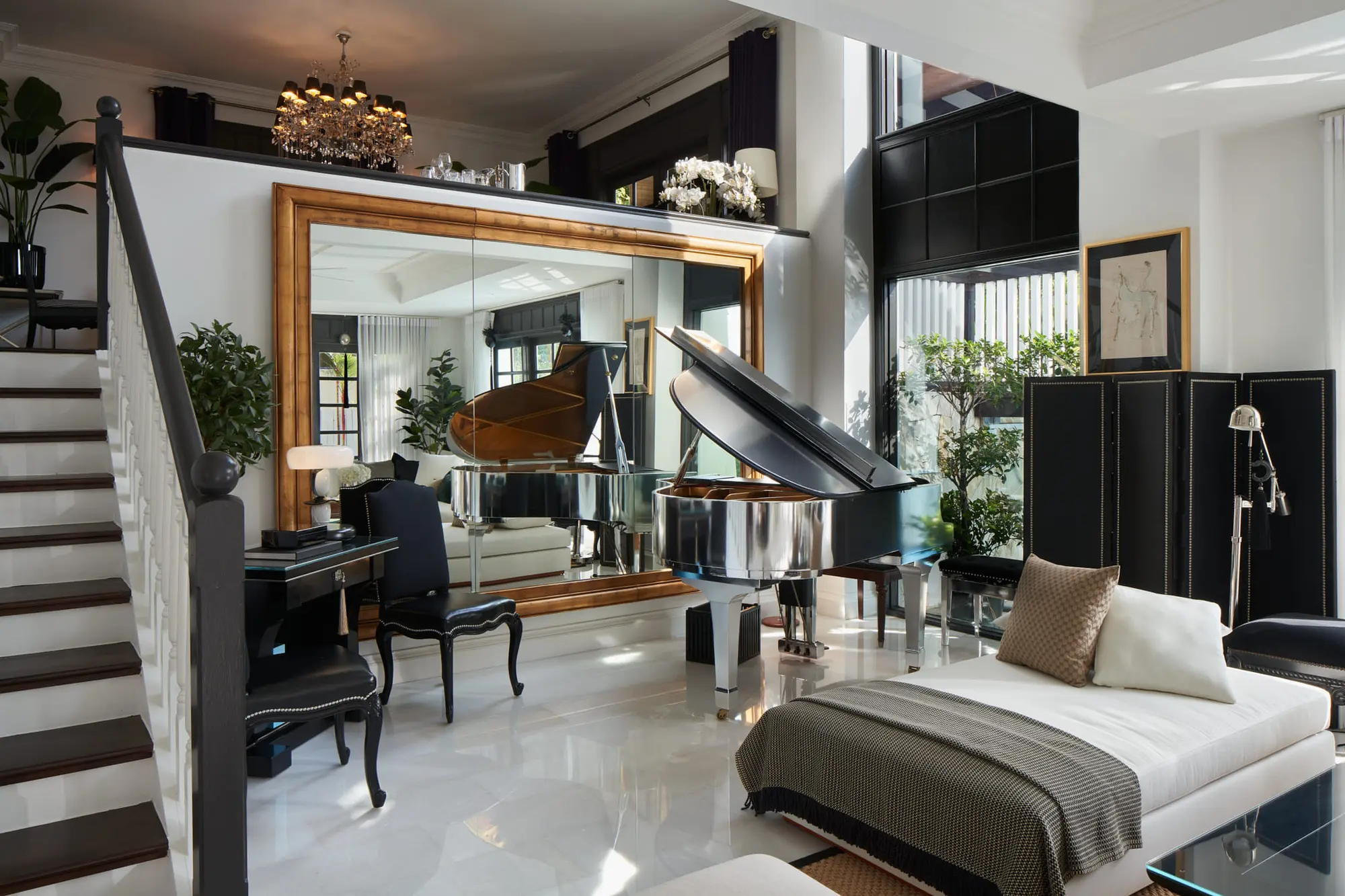 Principal suite with a full-height mirror and a grand piano beyond