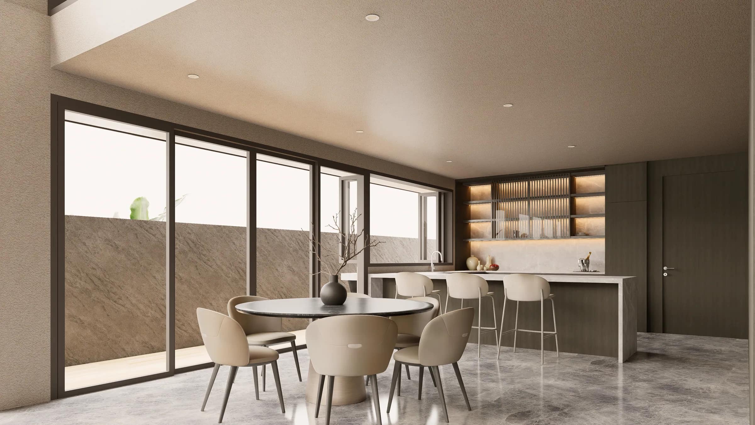 Daylight reaching deep into a dining room through a full-height opening.
